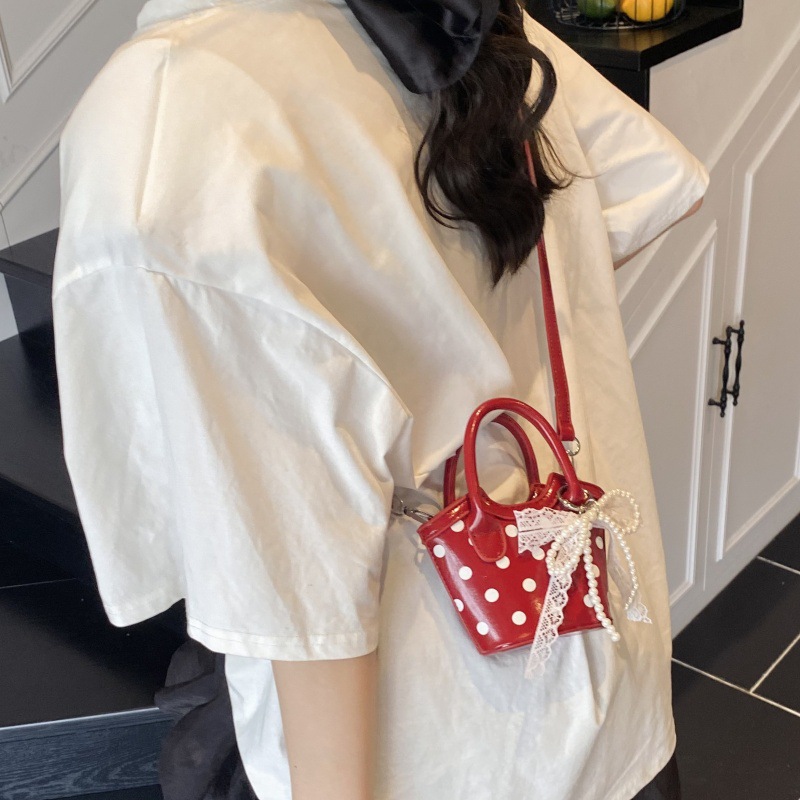 Bolso de moda coreano 2025 verano nuevo bolso femenino diseño de nicho bolso de hombro mini bolso de mensajero de lunares marea