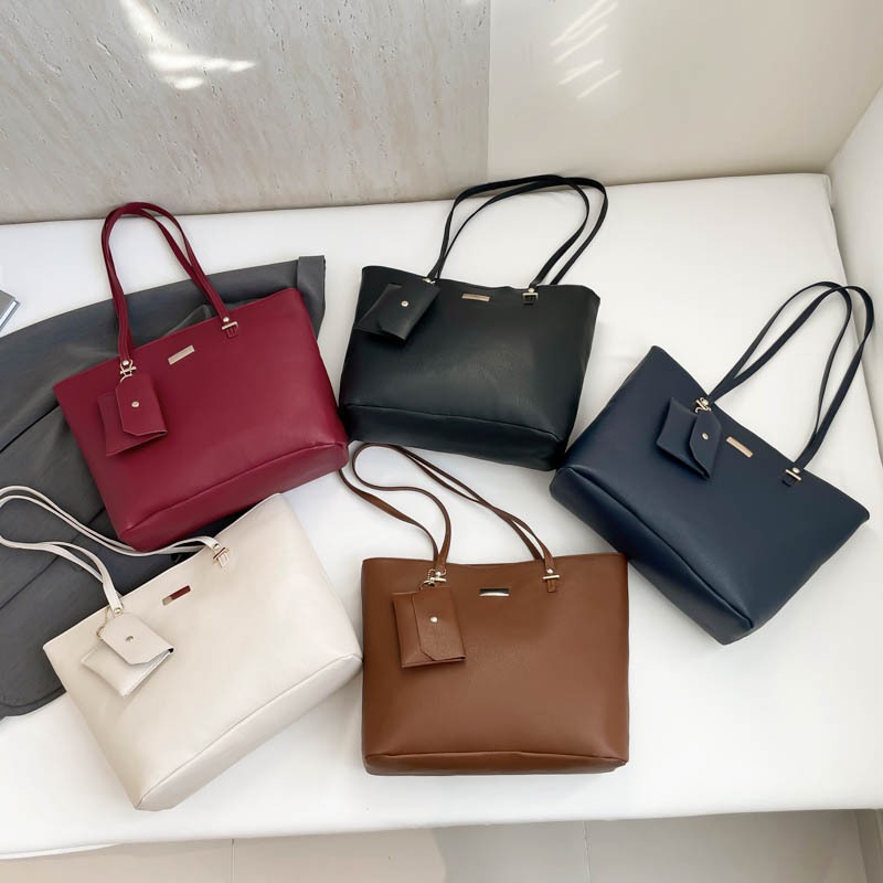 Bolsa de combinación de gran capacidad bolso de mujer 2025 primavera nueva moda simple textura mochila de hombro bolso de viaje de mujer