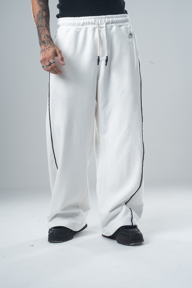 Pantalones deportivos casuales versátiles de pierna recta para otoño e invierno 2025, pantalones holgados retro de moda con costuras laterales de patchwork para hombre.