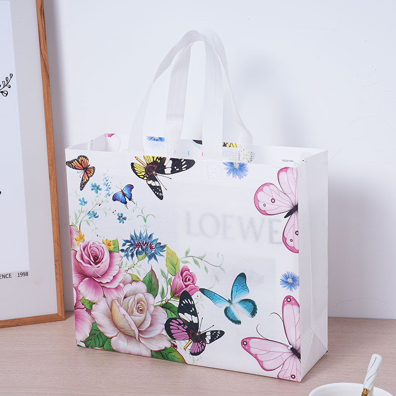Bolsas de compras no tejidas al por mayor Bolsas de compras no tejidas recubiertas Bolsas de ropa logotipo personalizado al por mayor
