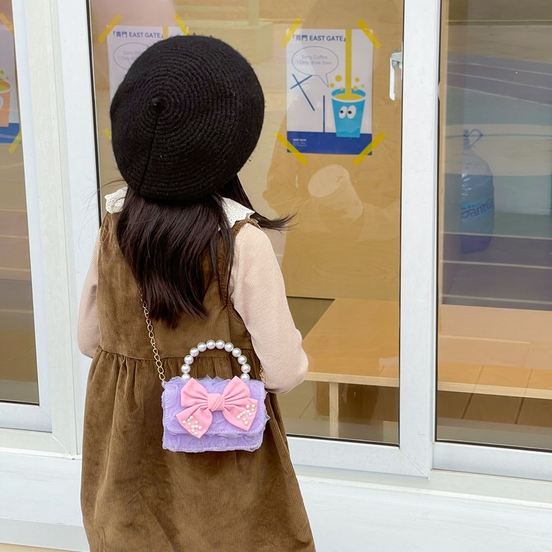 Dulce princesa bolso de hombro de perlas de aire extranjero bolso de mano para niños 2025 mini bolso de arco para niños