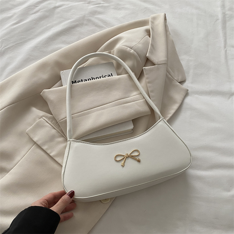 Bolso de axila con lazo para mujer 2025 nuevo bolso de bola de masa de lujo simple y ligero de alta calidad textura bolso de mensajero de un solo hombro marea