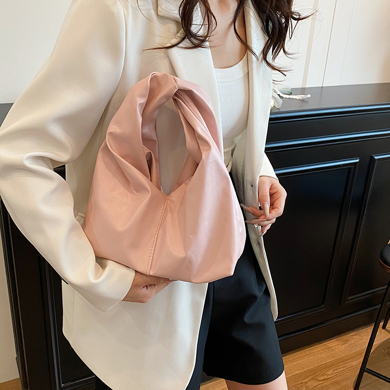 Diseño de nicho, bolso de mano de alta gama, primavera y verano, nueva moda, todo fósforo, simple, color sólido, bolso de mano casual, mujer