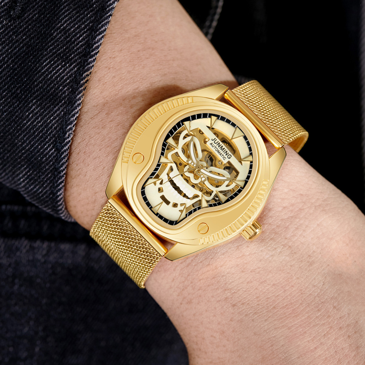 JUNMING Suiza productos genuinos moda impermeable reloj de los hombres correa de acero luminoso reloj mecánico automático cráneo hueco