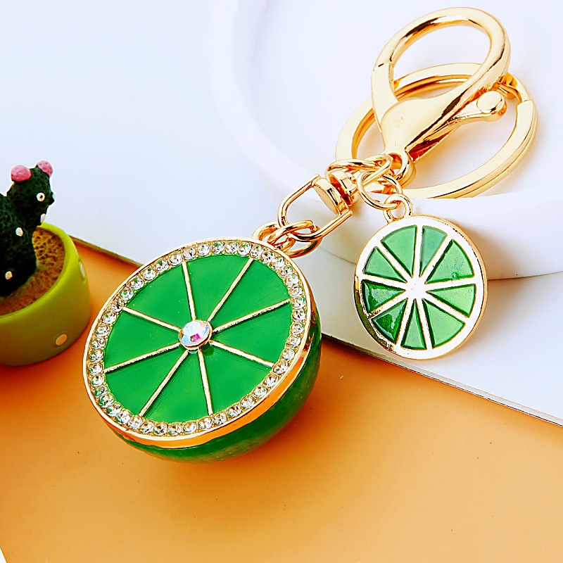 Creativo lindo diamante fruta pequeño limón llavero del coche bolso de las mujeres colgante de metal llavero anillo de regalo de dibujos animados