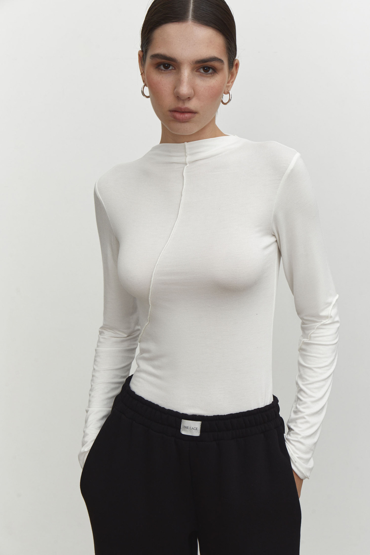 Half high neck base shirt with spring trend slanted edge splicing design, elastic slim fit long sleeved T-shirt_voghion.com