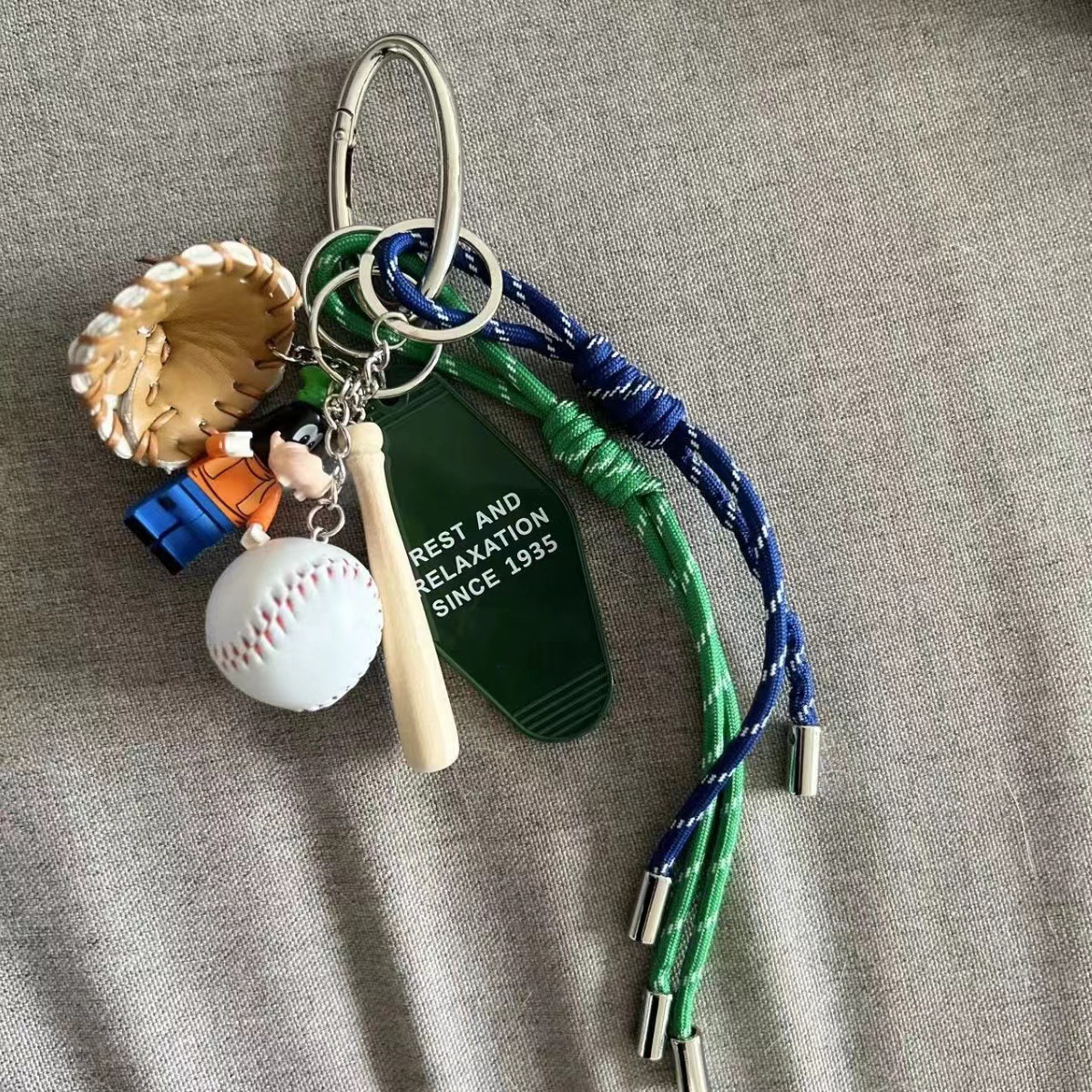 Gaofei green trumpet baseball blue and green rope (silver oval keychain)