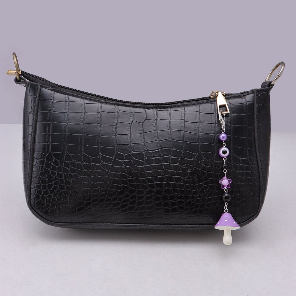 La versión coreana transfronteriza de la joyería de llavero de setas de color, la resina de dibujos animados, el ojo creativo del diablo, el bolso, el colgante de accesorios