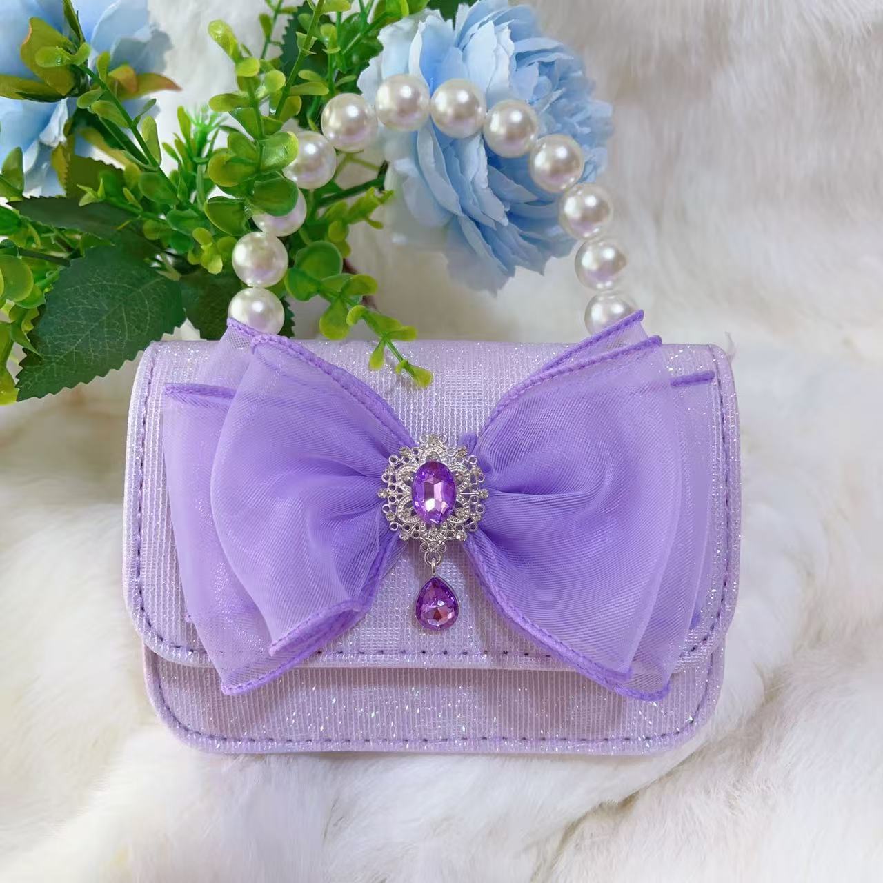 Bagos de perlas para niños 2025 nuevos bolsos de niños bolsos de mochila de niñas bolsos accesorios de princesa bolsos de viento de fragancia