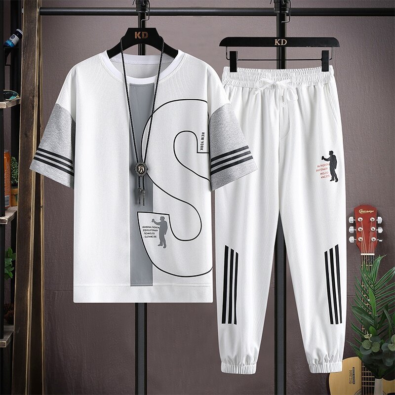 Una pieza de generación de cabello traje de moda de estilo caliente de verano para hombres, camiseta de manga corta de tendencia para hombres, pantalones casuales, traje de dos piezas