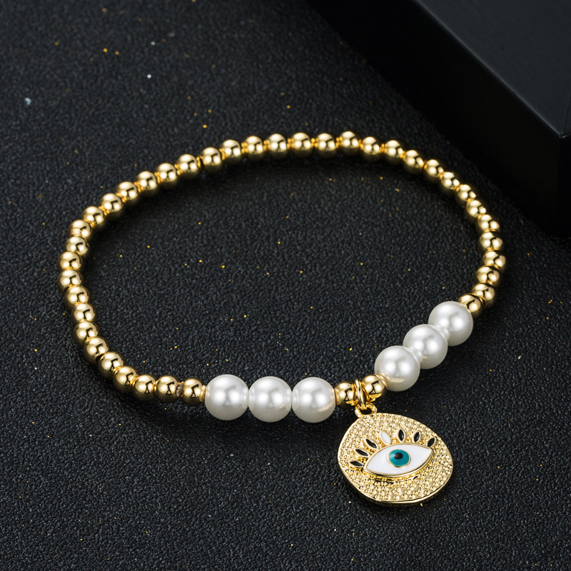 Fashion New Copper Gold-plated Oil Devil's Eye Bracelet Copper Beads Pearl Elastic Bracelet display picture 3