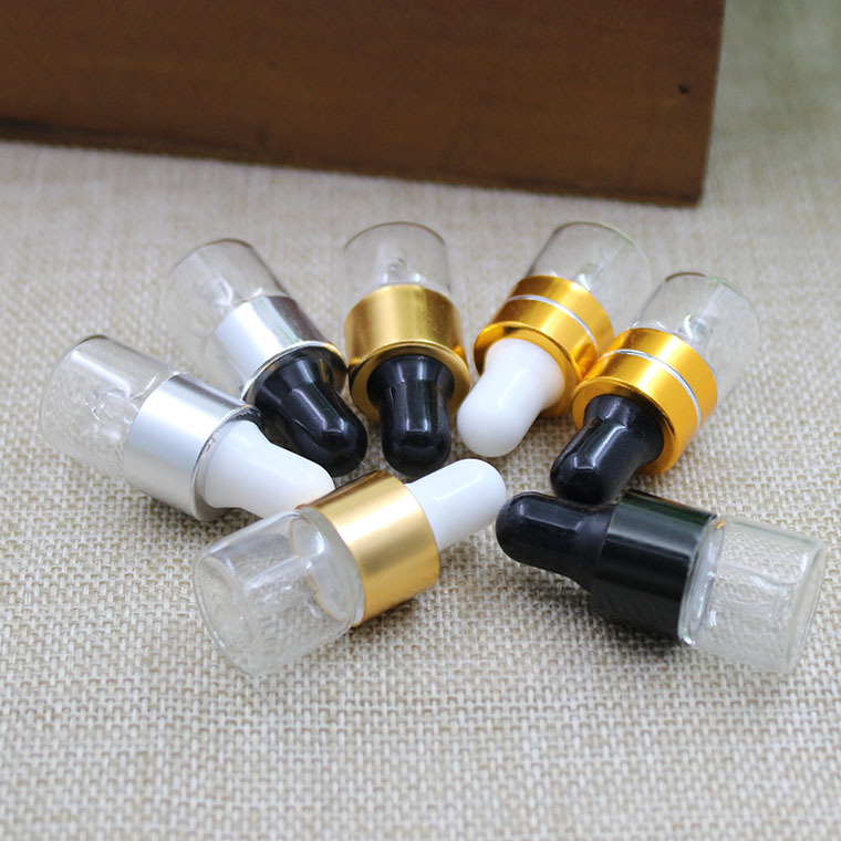 1ml de fábrica al por mayor botella de aceite esencial transparente tangente oro blanco pegamento cabeza cuentagotas botella de vidrio botella pequeña muestra botella sub-botella