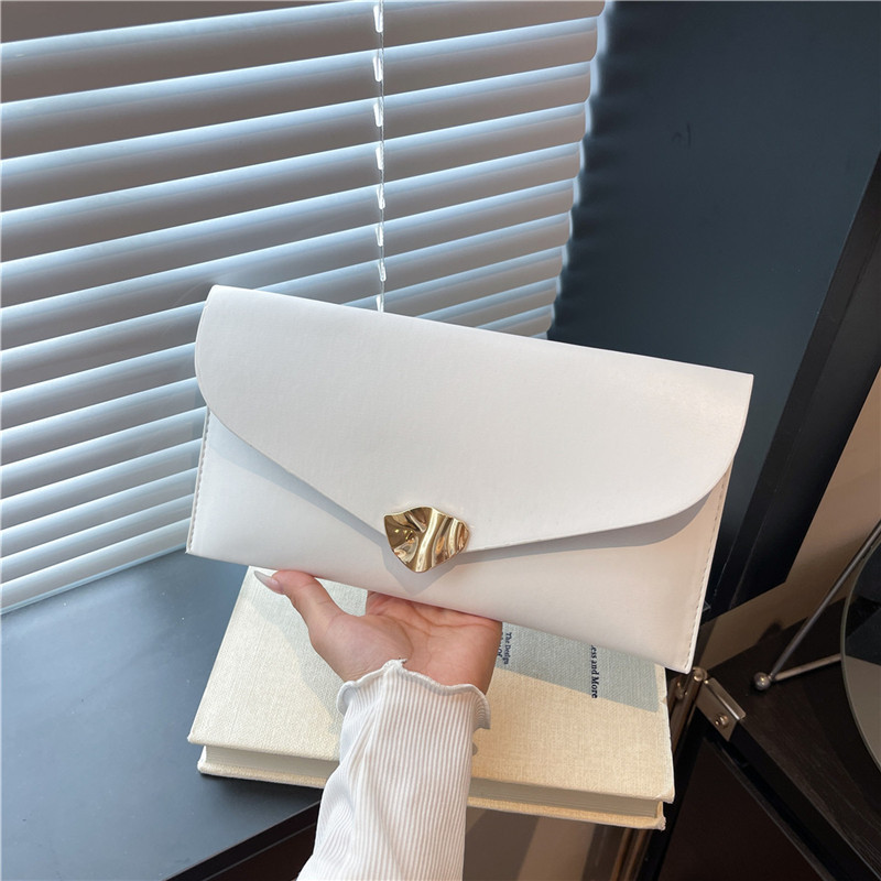 Tendencia de estilo extranjero nueva bolsa de sobres de gran capacidad de otoño 2025 moda casual simple estilo coreano bolso de mano de mujer