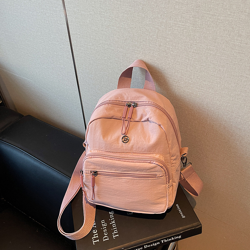 Mini mochila ligera coreana de moda casual mochila de viaje al aire libre de viaje de viaje simple mochila de estudiantes