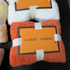 A set of pineapple print edge-bound high-density coral velvet towels with silk ribbon ties and rose-shaped badges, serving as corporate gifts or handkerchiefs.