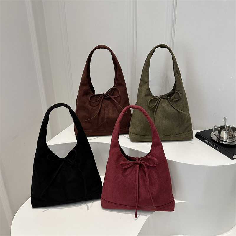 Lazos de nicho coreano estilo de moda ocio retro gamuza viaje de hombro único arco axilar bolsa de moda