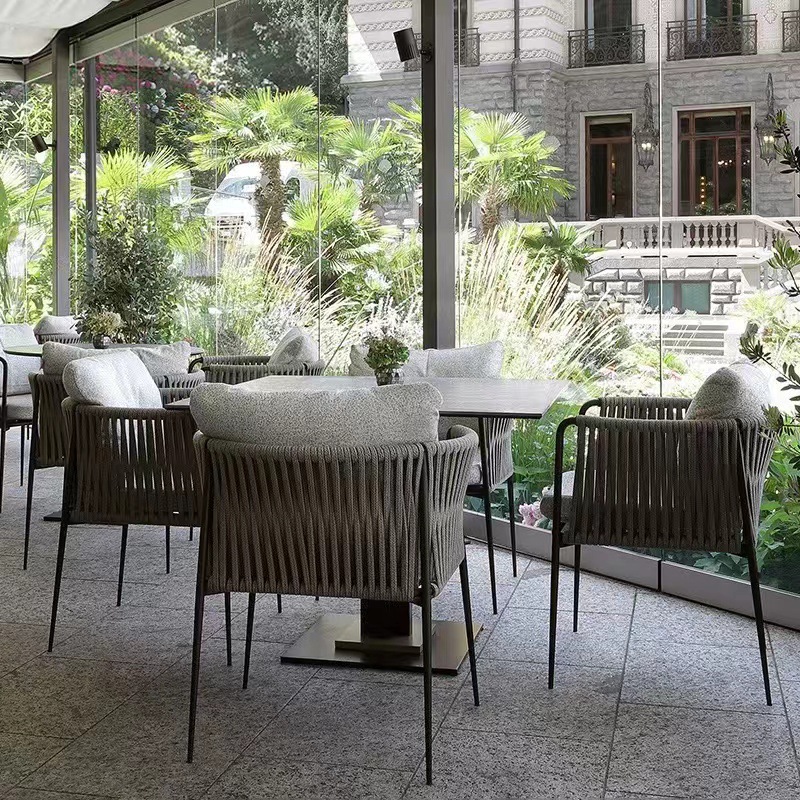 Mesa y silla al aire libre, patio, silla de caña, simple impermeable, protección solar, casa, jardín, restaurante, balcón al aire libre, combinación de tablero de roca