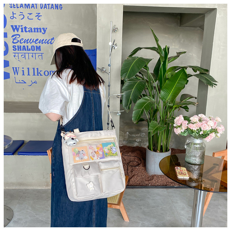 Large-capacity Japanese-style single-shoulder canvas bag for girls, versatile crossbody, ins, a tote bag for junior high school students' classes, and a schoolbag for after-school tutoring undefined