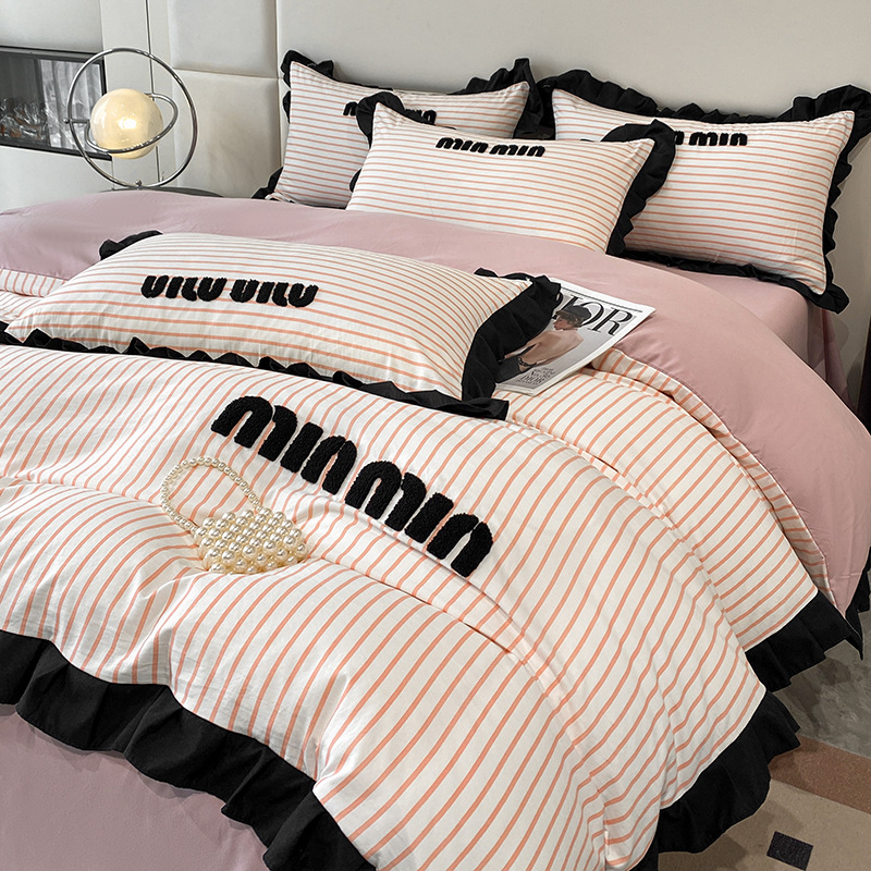 2024 nuevo estilo francés pequeño bordado de toalla de fragancia cuatro piezas funda de edredón sábana simple ropa de cama Nantong al por mayor