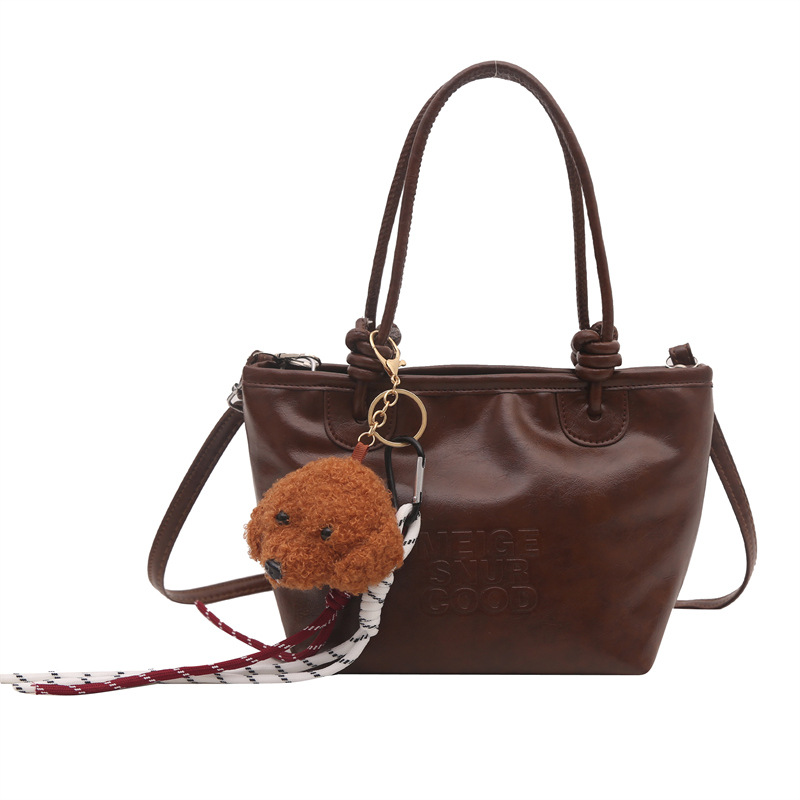 Estilo occidental retro pequeño bolso femenino 2024 nuevo otoño e invierno bolso de mensajero literario de moda bolso de cubo portátil de moda