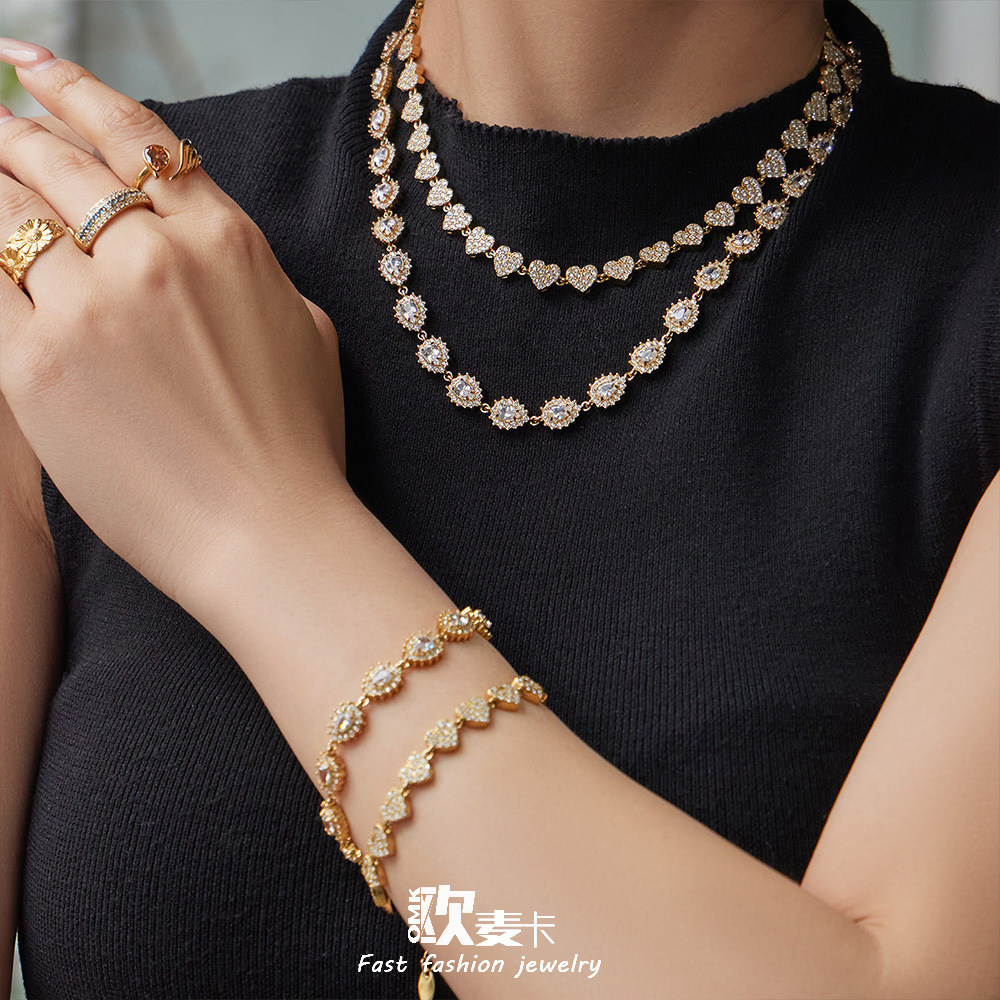 Luxury teardrop zircon claw-set diamond bracelet and necklace set with vintage stainless steel pendant and earrings. Wholesale.