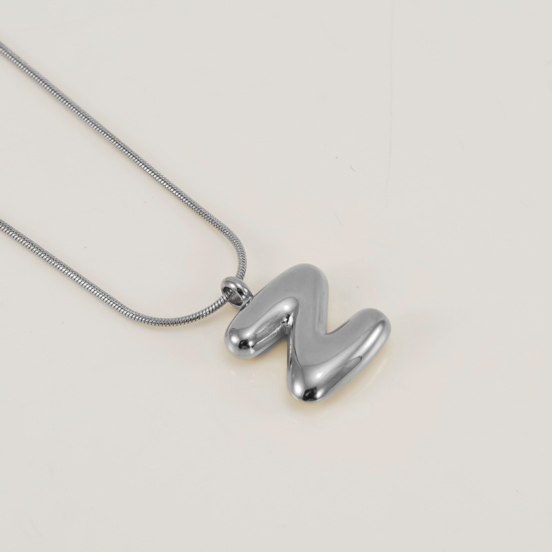 Burbujas transfronterizas 26 letras inglesas colgante brillante collar nicho universal oro acero titanio joyería collar