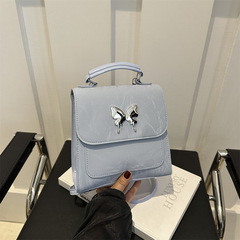 設計感洋氣純色2024新款時尚休閒蝴蝶五金學院風背包單肩雙肩包女