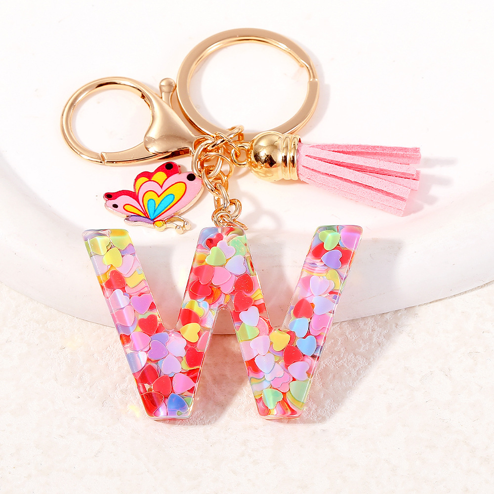 2024 puntos transfronterizos de resina de sequilla rosa 26 letras inglesas llavero colgante mariposa fringe accesorios