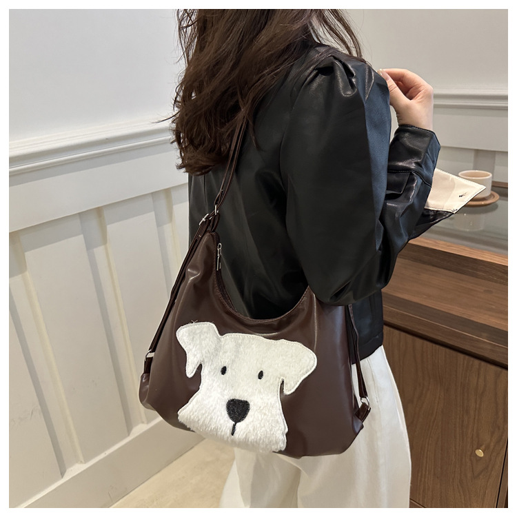 The new autumn and winter 2024 fashion cartoon backpack with simple, individual and niche design, single-shoulder bag and commuter tote bag undefined