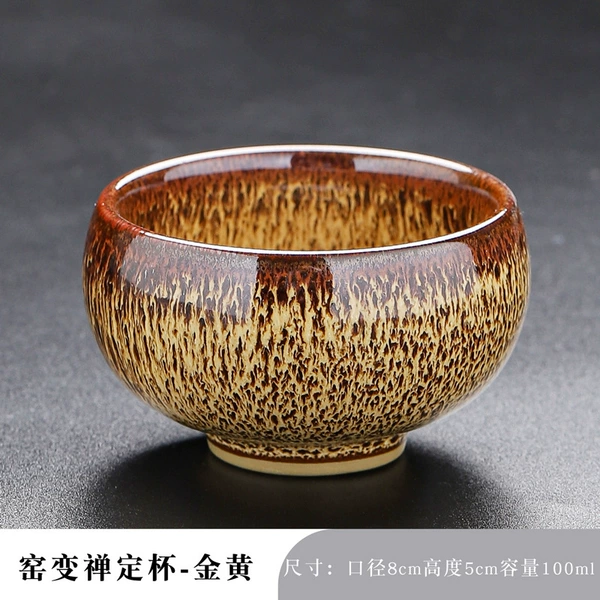 The kiln turns the meditation cup into golden color