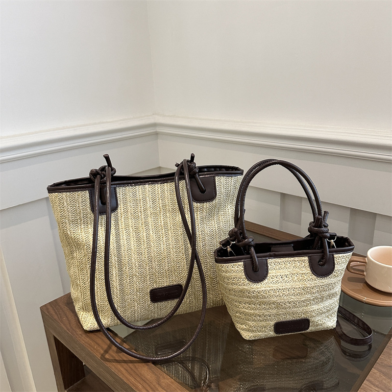 Bolsa de paja tejida para mujeres 2024 verano nuevo mochila portátil versátil bolso de balde de agua de estilo exterior bolso de trabajo