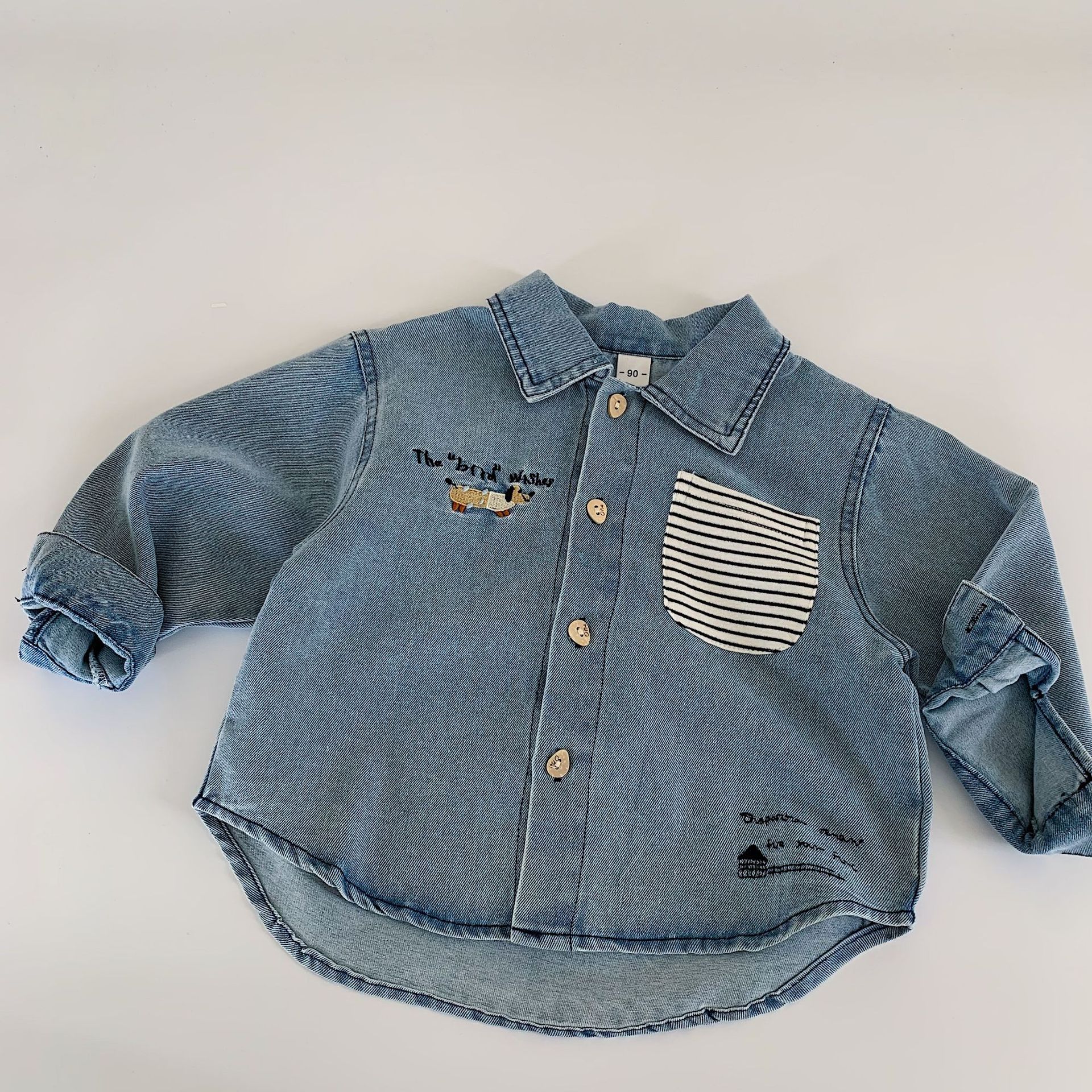 Mai Bao camisa de vaquero para niños 2025 otoño nuevo estilo coreano camisa de dibujos animados para niños Huzhou ropa de tela para niños