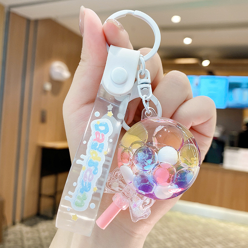 Perla leche taza de té oso colgante aceite flotante botella llavero femenino exquisito colgante mochila arenas movedizas colgante