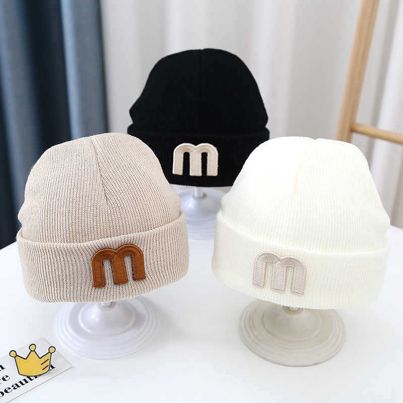Children's woolen demi-season knitted hat for early age