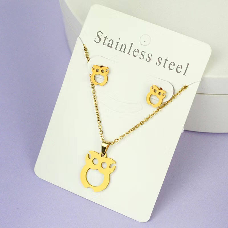 Net Red Butterfly Love Cross Personalidad Simple Juego de joyas de acero inoxidable Pendientes de oro Juego de collar al por mayor