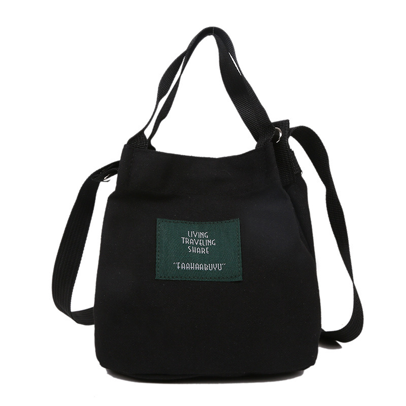 Bolso de mujer nuevo estilo coreano simple bolso de lienzo de chicas fresco de color sólido bolso de cubo de moda moda bolsa de mochila casual