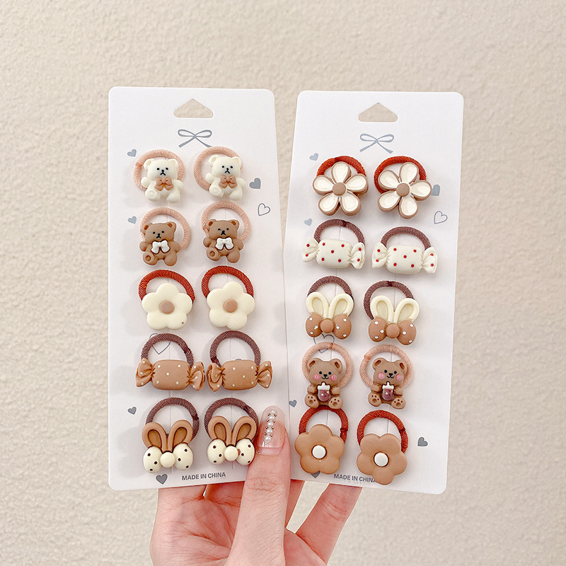 Los niños de la banda del pelo del bebé de la historieta no lastiman la banda de goma del pelo de la niña volumen del pelo menos cuerda del pelo del bebé