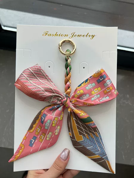 Orange bow pendant