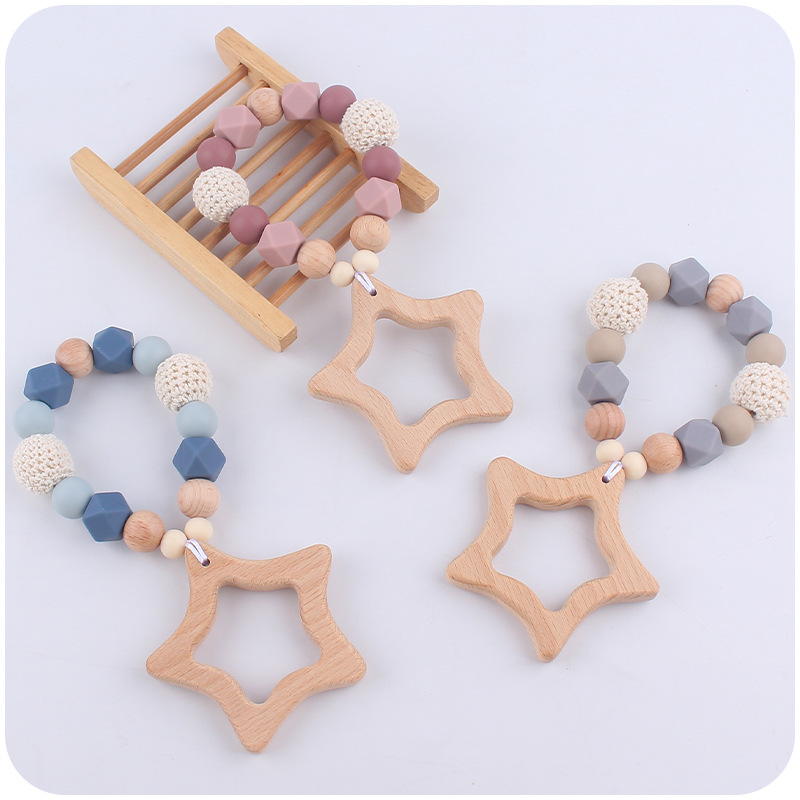 Nuevo bebé de dibujos animados Beech Star teether DIY calmante bebé mordedura de pegamento molar pulsera juguete