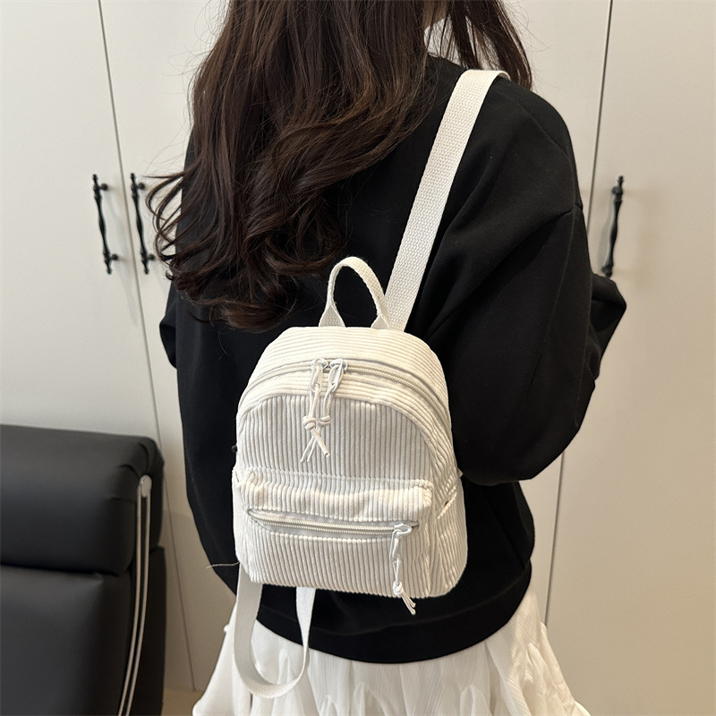 2025 nueva mochila casual japonesa tendencia universal mochila de moda simple nicho bolso portátil ligero