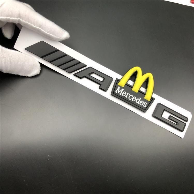 Mercedes-Benz C-Class, E-Class, and S-Class modified with AMG emblems, McDonald's car logos, BMW M logos, and new AMG tail emblems with black lettering