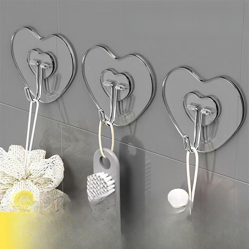 Heart-shaped hook, strong adhesive hook, no drilling required, traceless self-adhesive, wall-mounted storage for kitchen, bathroom, and home use Heart-shaped hook, strong adhesive hook, no drilling required, traceless self-adhesive, wall-mounted storage for kitchen, bathroom, and home use