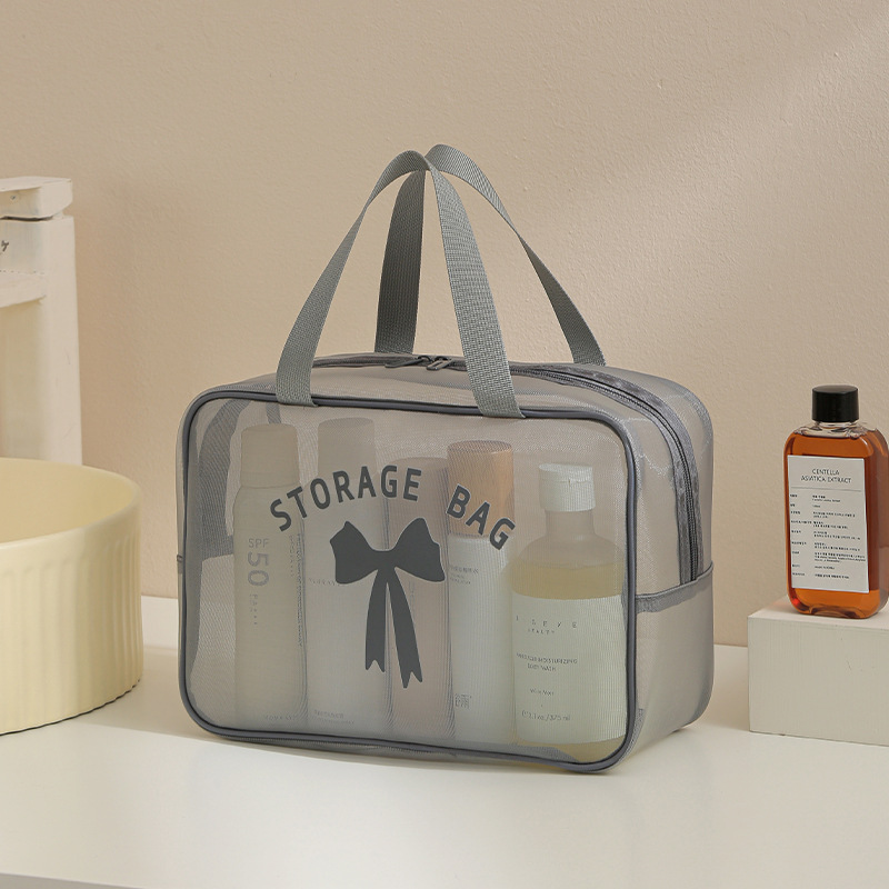 Bolsa de almacenamiento de lavado de hilo de red Bolsa de cosméticos de almacenamiento de viaje anti-salpicaduras Bolsa de almacenamiento de cosméticos de alto valor transpirable al por mayor