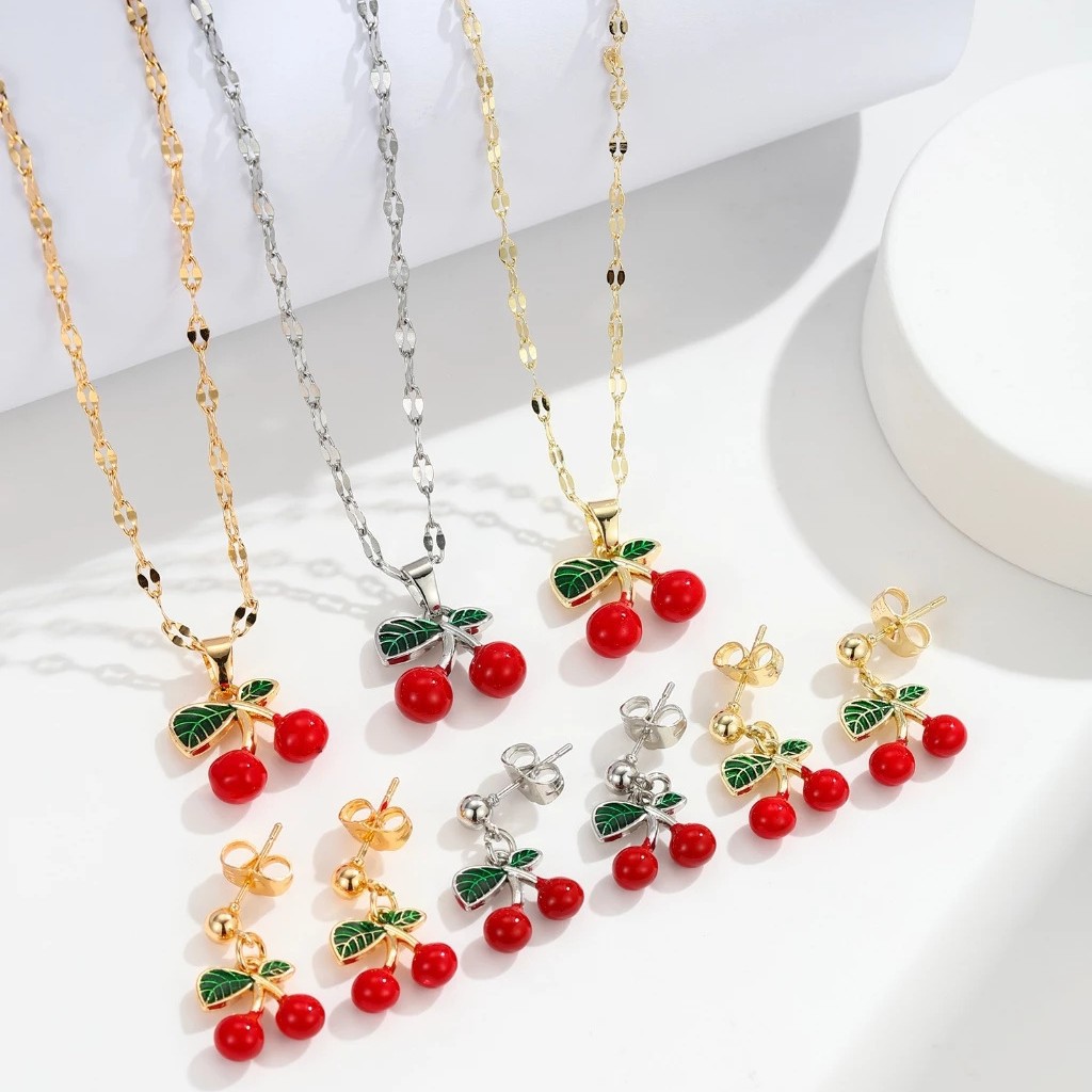 Explosiones transfronterizas coloridas cereza roja pintada a mano goteo de frutas series de joyería simple colgante de viento conjunto de aretes collar