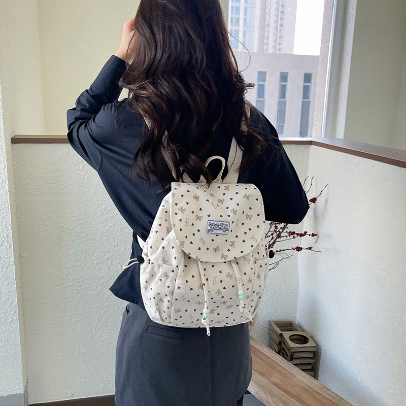 2026 mochila de viajes escolares de gran capacidad para mujeres coreanas frescas pequeñas ondas de diseño de moda mochila de moda mochila de moda
