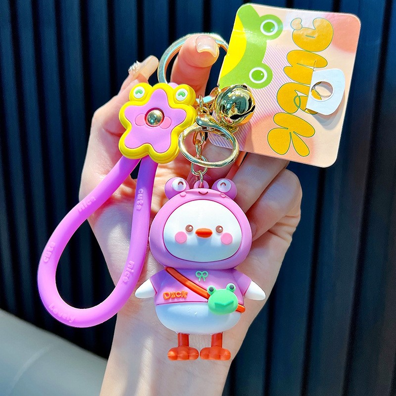 Keychain dinosaurio auténtico lindo bolso colgante de goma blanda llavero de automóvil muñeca pequeña máquina de regalos al por mayor image 18