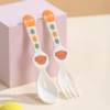Light yellow fork and spoon with garlic