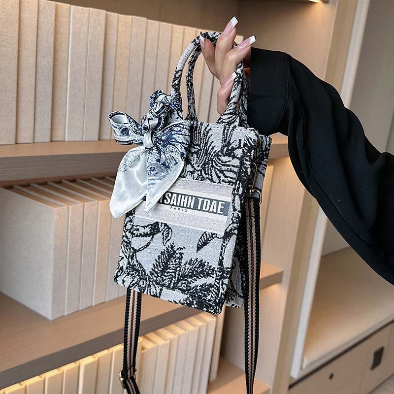 Bolso pequeño para mujer, nuevo bolso de mano vertical personalizado de moda europea y americana, bolso cruzado con estampado de lona de nicho