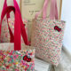 Small floral KT cat cotton shoulder bag small floral element small fresh hand shoulder cloth bag hand bag wholesale
