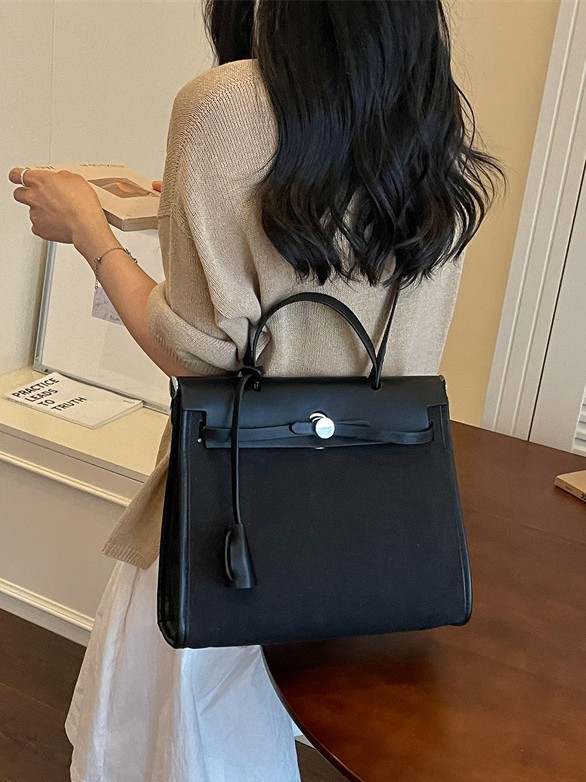 Nicho de moda portátil Kelly bolso mujer 2026 nuevo cross-border lienzo empalme color contraste viaje mochila de hombro